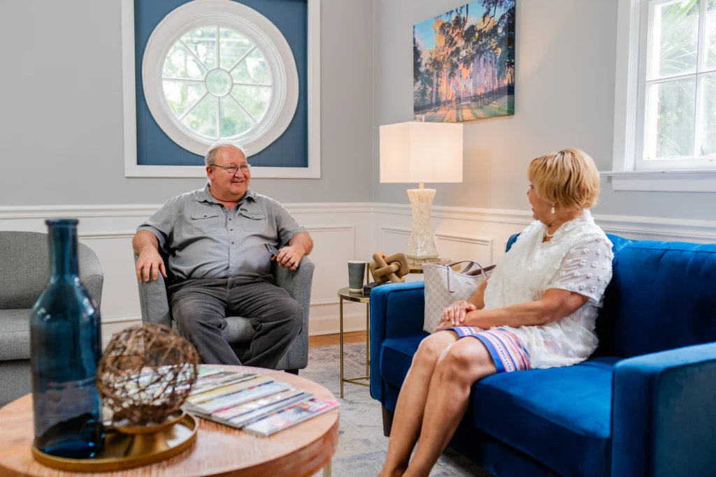 Two patients speaking with each other in the waiting area
