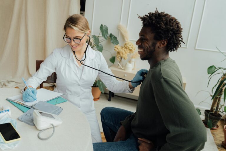 doctor checking patient's heart health after visiting Beaufort dentist